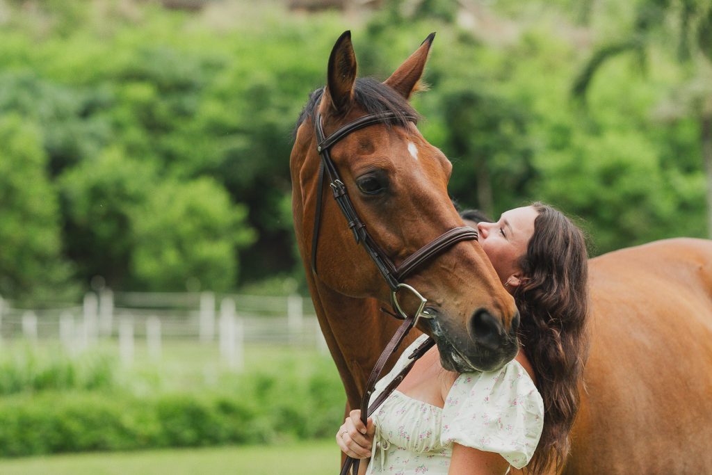 a girl with her horse showing the bond between horse and rider