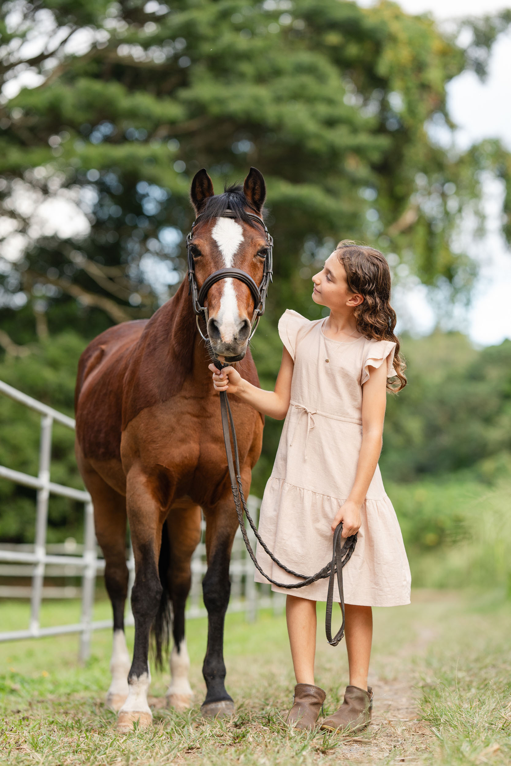 a girl holding her pony